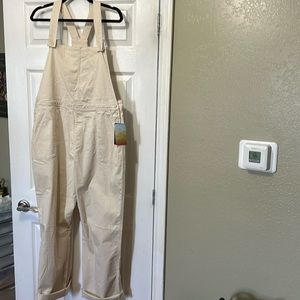 Cream colored bib overalls. NWT never worn